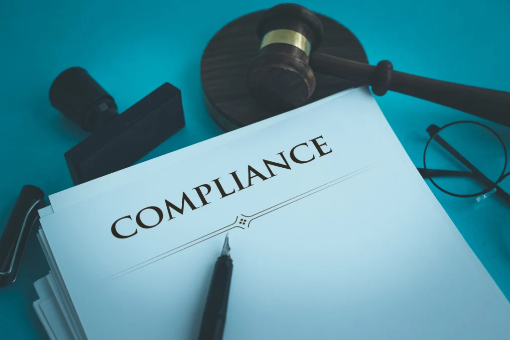 Compliance paperwork and gavel representing supplement manufacture regulations