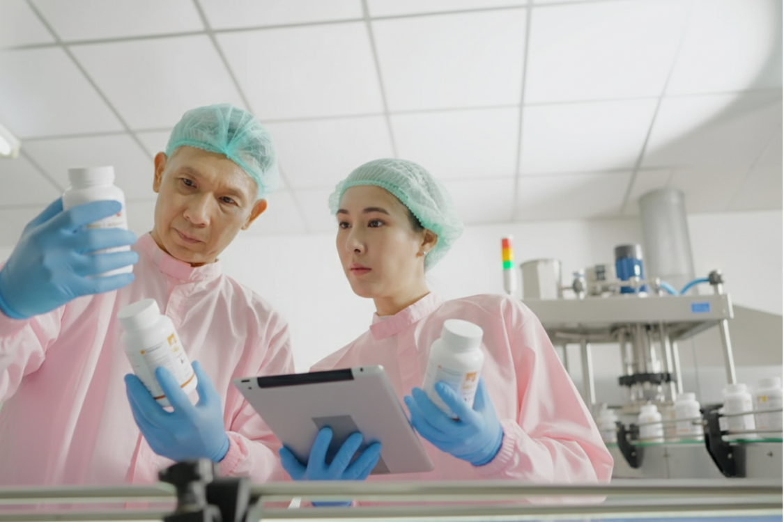 Inspectors reviewing supplement bottles for supplement manufacturer compliance documents and quality control