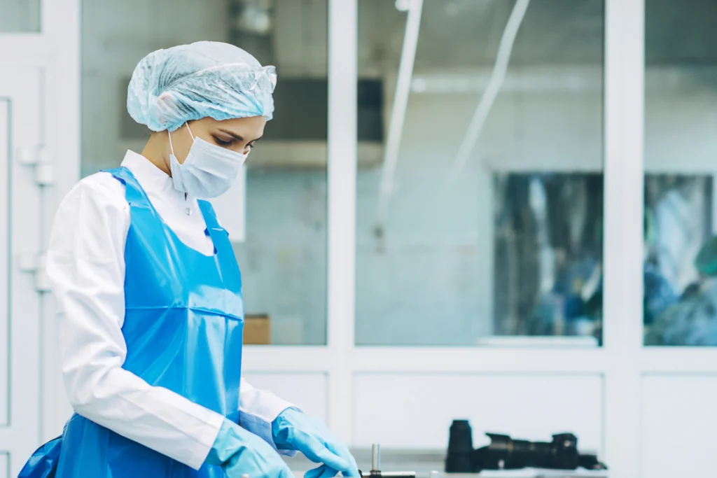 Lab worker ensuring supplement manufacturer financial stability through quality control