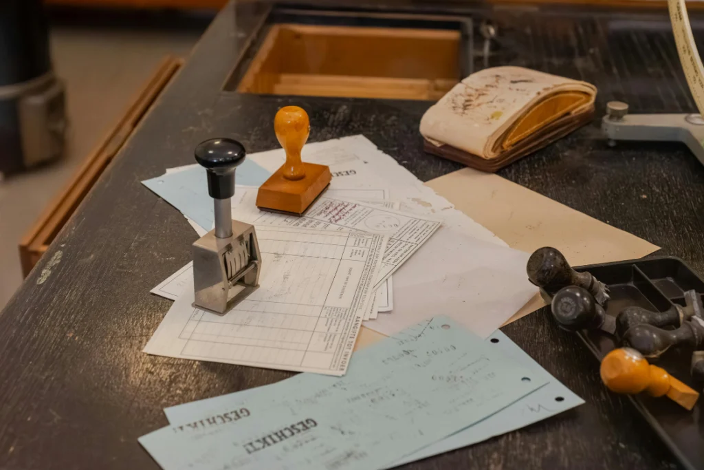 A desk with forms, paper, and rubber stamps, reflecting the official nature of supplement manufacturer public records and compliance.