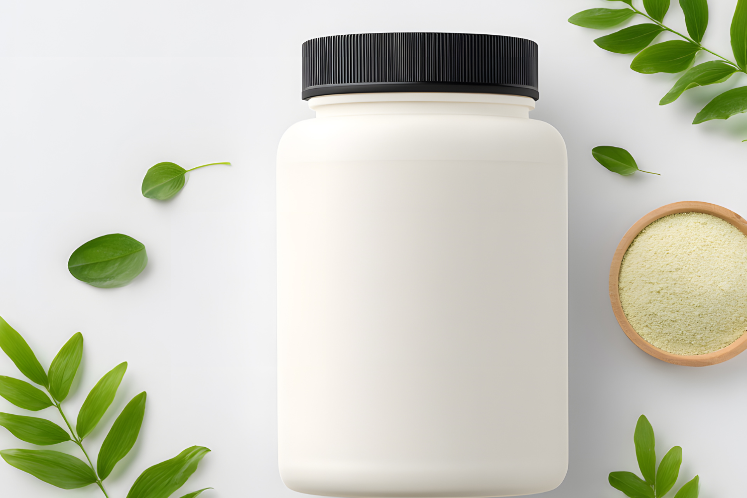 A white plastic jar with a black lid surrounded by green leaves and a small wooden bowl of yellow powder.