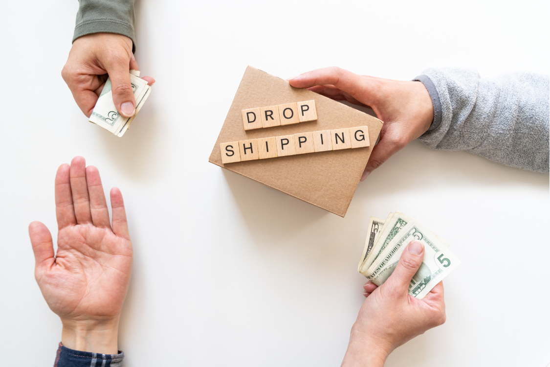 Hands exchanging cash over a cardboard box labeled "DROP SHIPPING," symbolizing the financial transaction in private label dropshipping supplements.